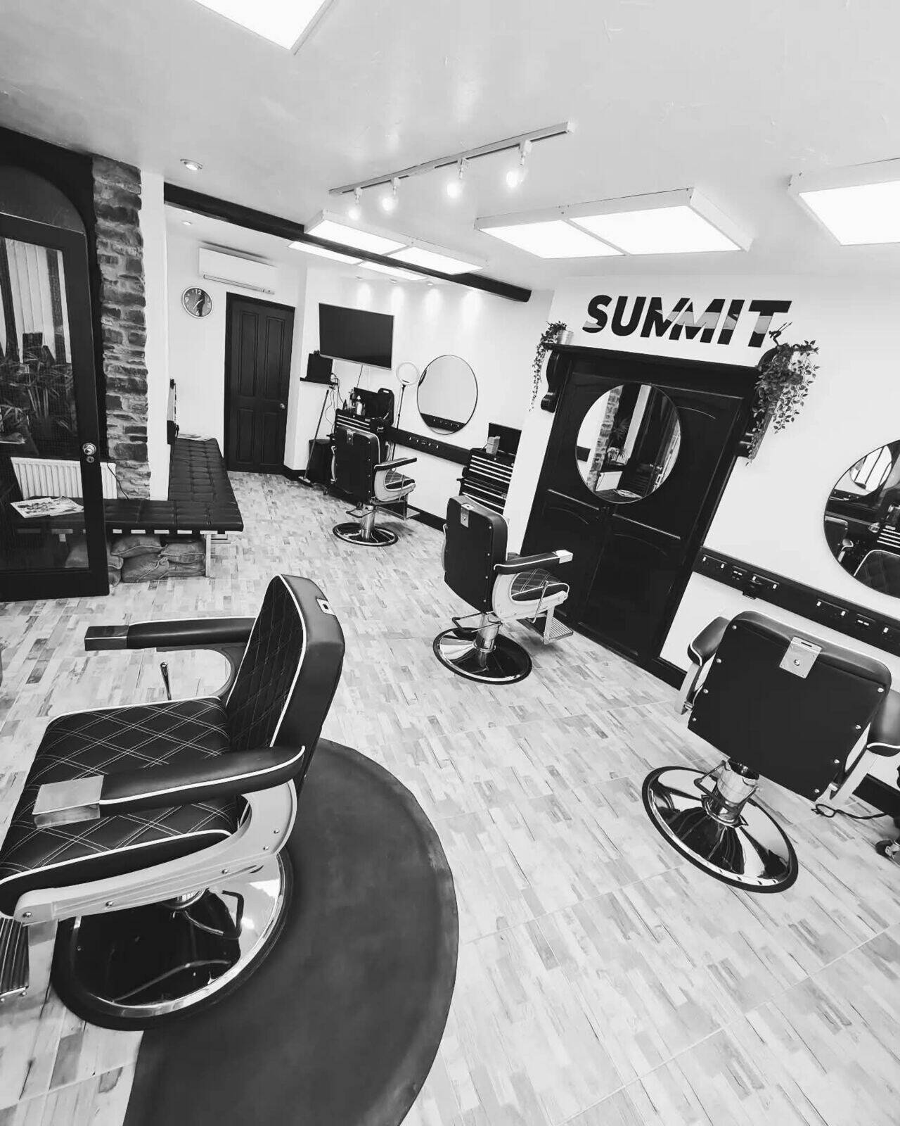 Inside Summit: barber chairs and the Summit wall sign